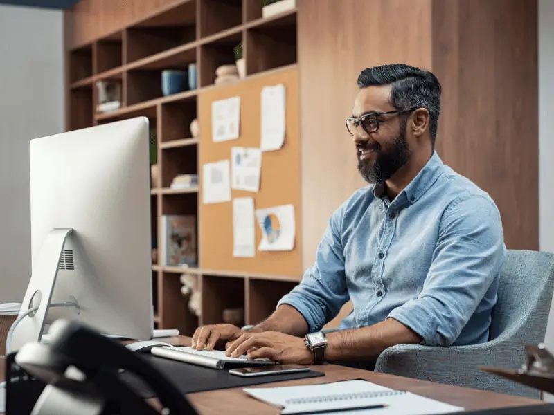 Homeowner calculating home equity using a HELOC calculator on laptop.