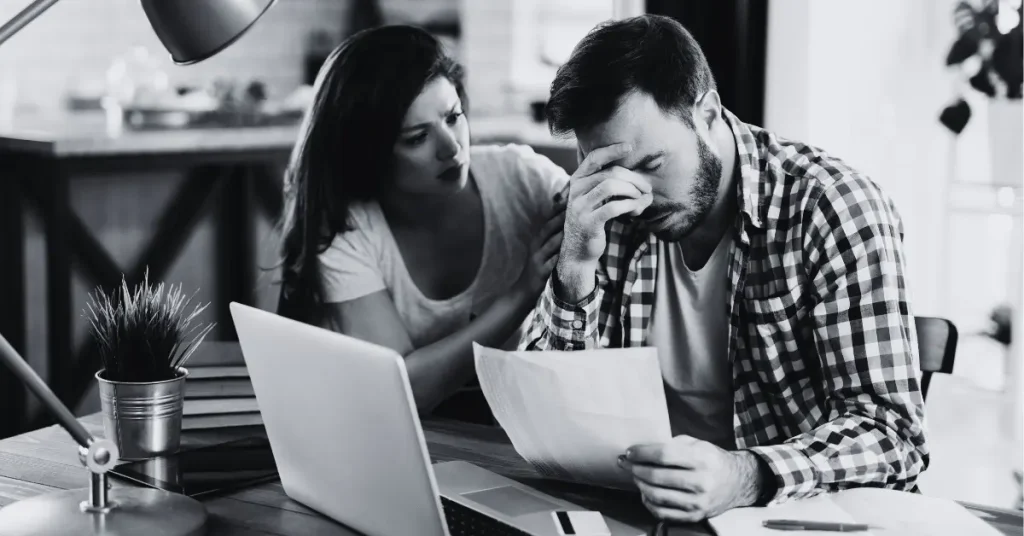 Homeowner reviewing a mortgage statement and noticing mortgage insurance charges